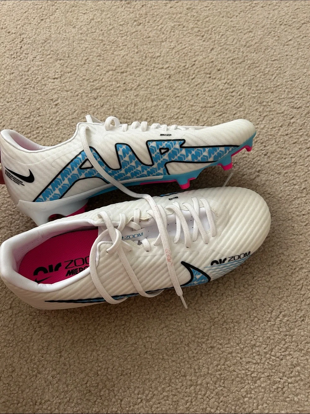 Nike Women's White Soccer Cleats with Blue Graphics and Pink Insole